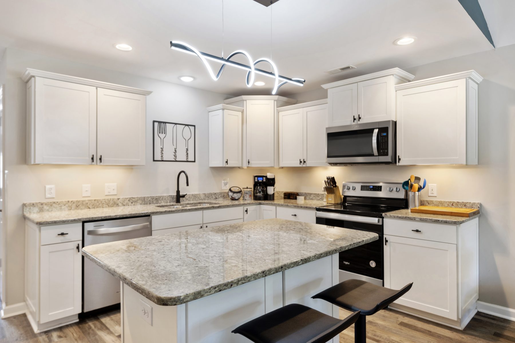 White kitchen with granite island