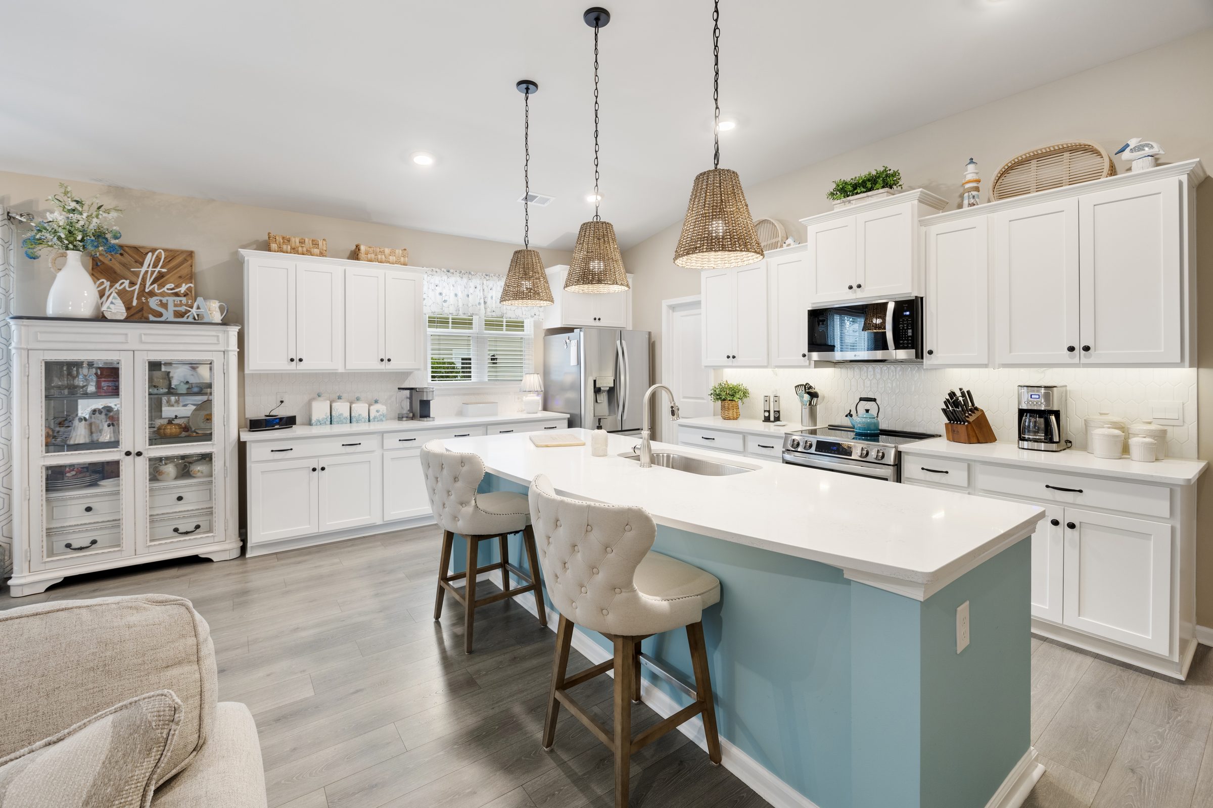 White kitchen with a blue island