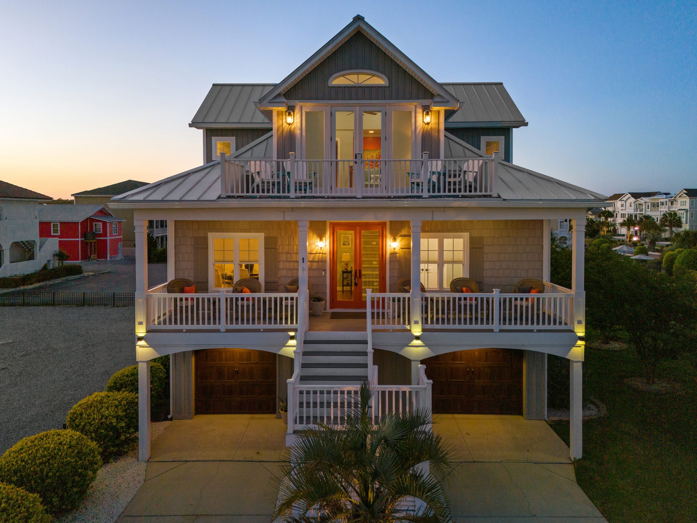 Drone photo of a coastal home at twilight